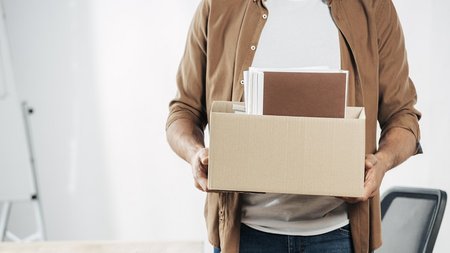 close-up-hands-holding-box-with-stuff