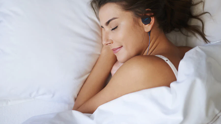 woman-sleeping-top-view-black-bedphones-1